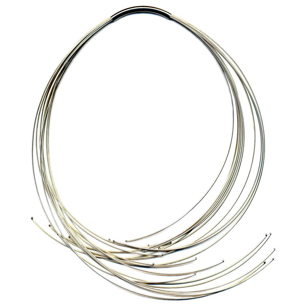 This 12 line African Necklace is our best seller! It is designed by New York based German jewelry designer, Katrin Zimmermann. This flowing neckpiece is made of Italian sterling silver cable. Great any day, anytime, anywhere necklace!