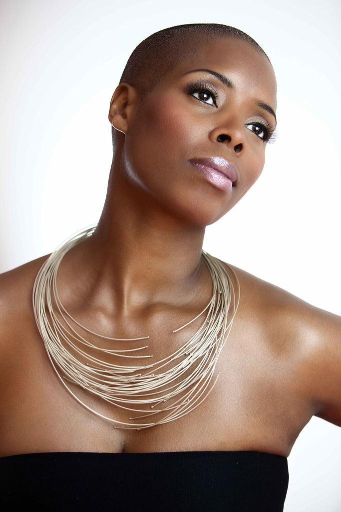 The sterling silver 16 line African necklace on model Sidra Smith.